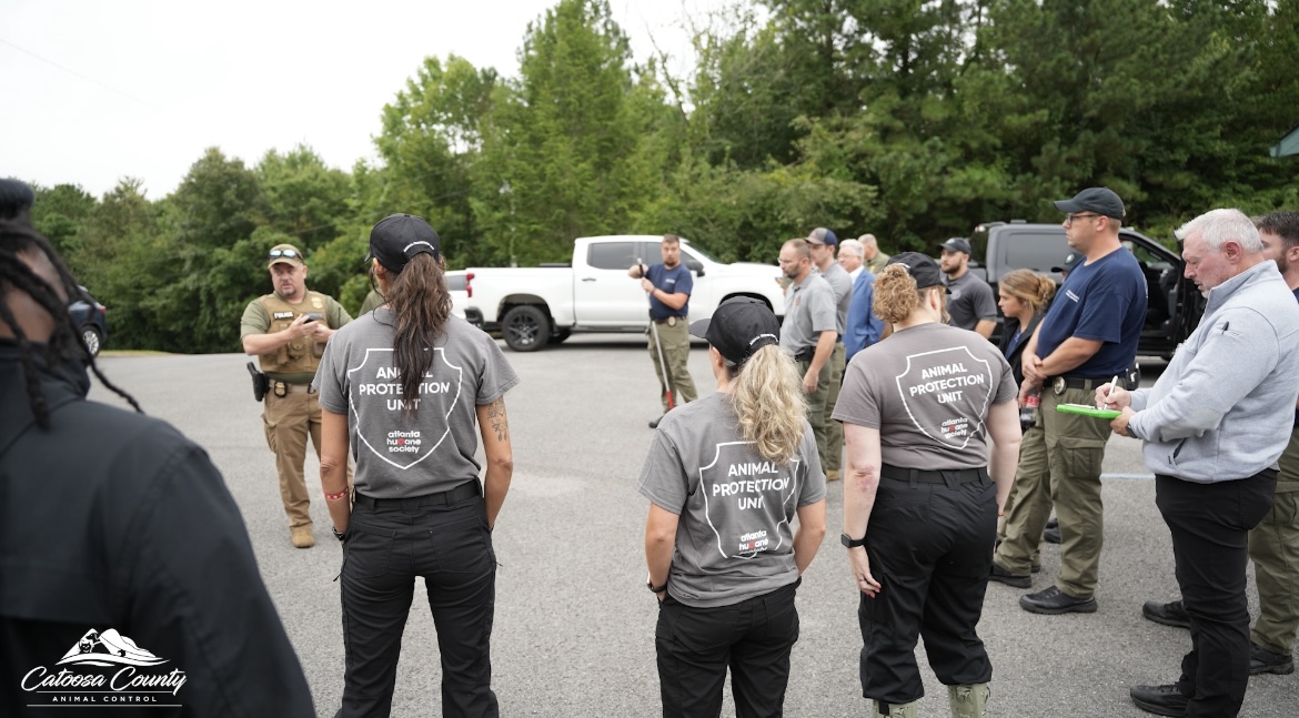 (Georgia Department of Agriculture Law Enforcement, Catoosa County AC, Murray County AC, Walker County AC, and Atlanta Humane Society Staff at staging point ahead of operation. Phone Credit: Catoosa County AC) (Georgia Department of Agriculture Law Enforcement, Catoosa County AC, Murray County AC, Walker County AC, and Atlanta Humane Society Staff at staging point ahead of operation. Phone Credit: Catoosa County AC)